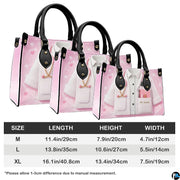 Model holding pink doctor handbag demonstrating carrying proportions and scale