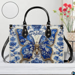 Close-up front view of matching blue butterfly zippered wallet