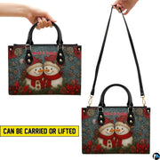 Top view showing top handles, detachable shoulder strap, and main zipper closure of handbag