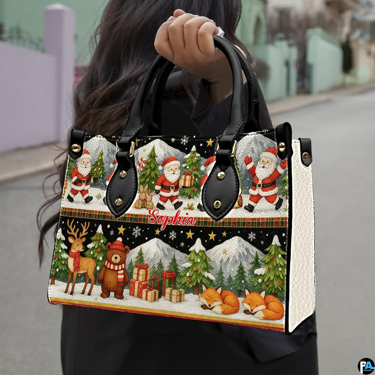 Detailed front view of handbag showcasing two-tiered holiday illustration of Santas, reindeer, and winter foxes.