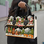 Detailed front view of handbag showcasing two-tiered holiday illustration of Santas, reindeer, and winter foxes.