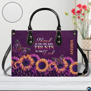 Side perspective view of purple sunflower accessory on plain studio background