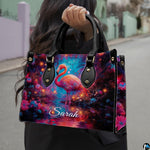 Outdoor lifestyle view of model carrying the enchanted glowing flamingo handbag.