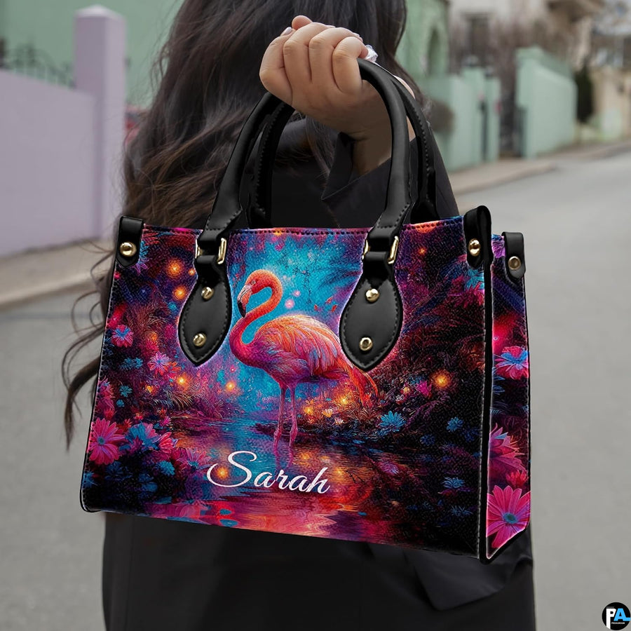 Outdoor lifestyle view of model carrying the enchanted glowing flamingo handbag.