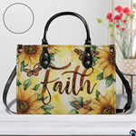 Front view of golden sunflower handbag showing radiant floral blooms and fluttering butterflies.