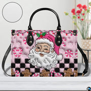 Pink Santa holiday handbag displayed in studio setting with circular texture swatch inset.