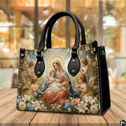 Tabletop display of Renaissance Madonna handbag highlighting rich oil painting tones and cherubs
