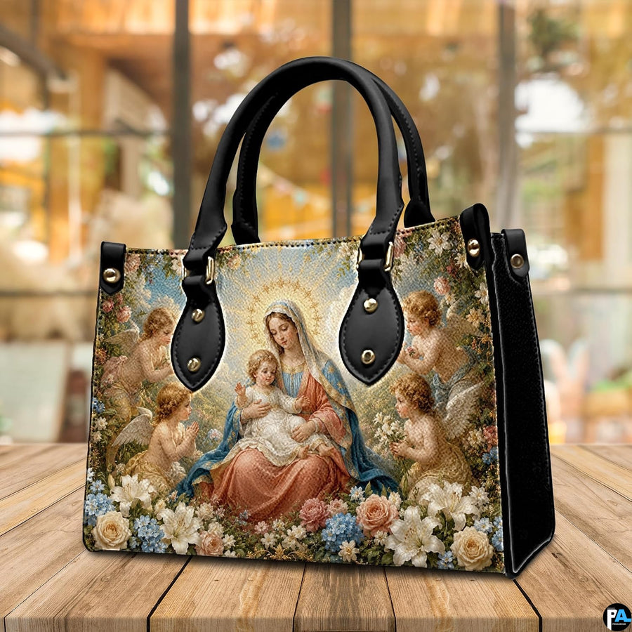 Tabletop display of Renaissance Madonna handbag highlighting rich oil painting tones and cherubs