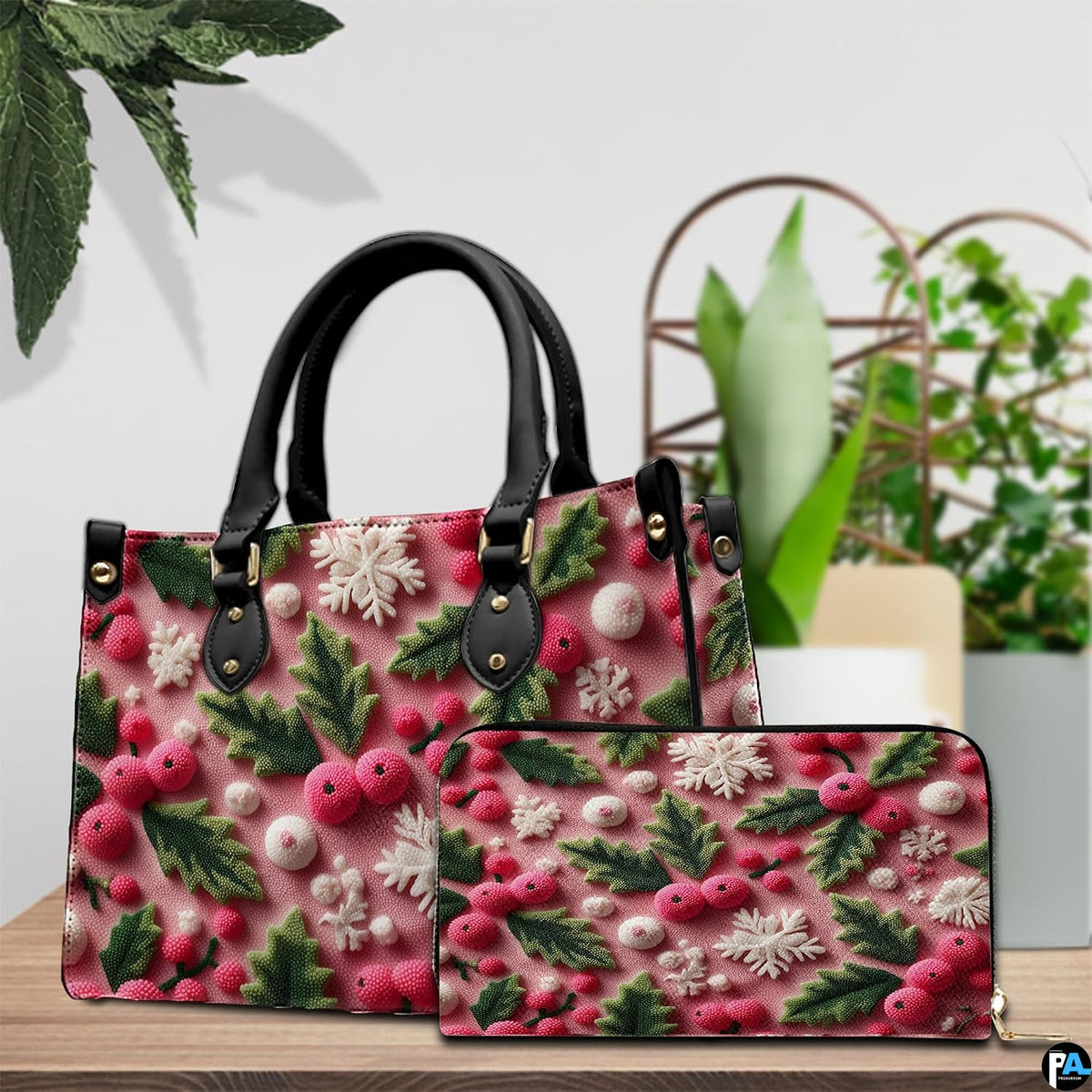 Tabletop scene showcasing pink winter pattern with green holly foliage beside houseplant