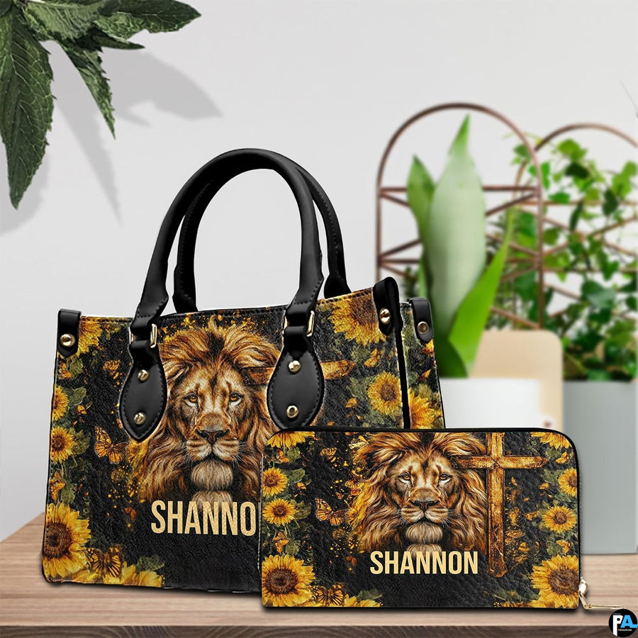 Detailed view of lion cross handbag showing handle hardware and intricate lion facial rendering.