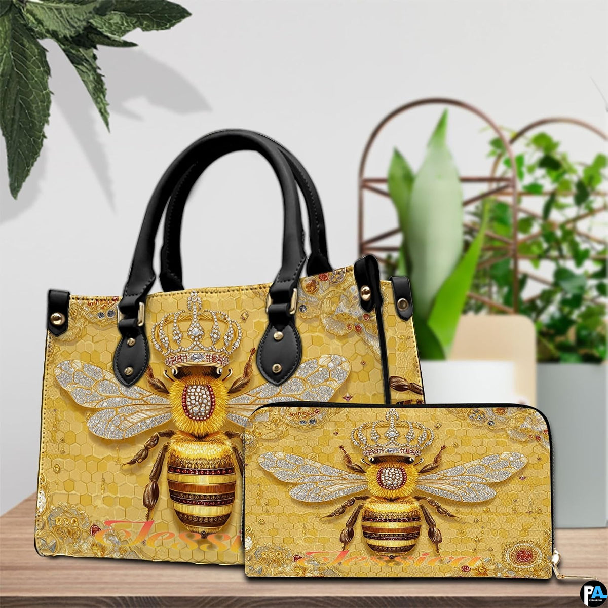 Side profile view of structured bee handbag showing sleek silhouette and black carrying handles.