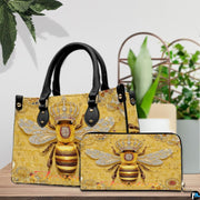 Side profile view of structured bee handbag showing sleek silhouette and black carrying handles.