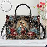 Model walking outdoors carrying Baroque framed Virgin Mary devotional handbag.