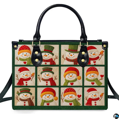 Front view of structured handbag featuring a twelve-block grid of festive snowmen in colorful hats and scarves.