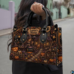 Witch cottage art accessory held outdoors showcasing fairytale garden, illuminated dwelling, and jack-o-lanterns.