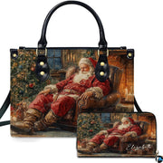 Front view of holiday handbag featuring sleeping Santa Claus by cozy fireplace and Christmas tree