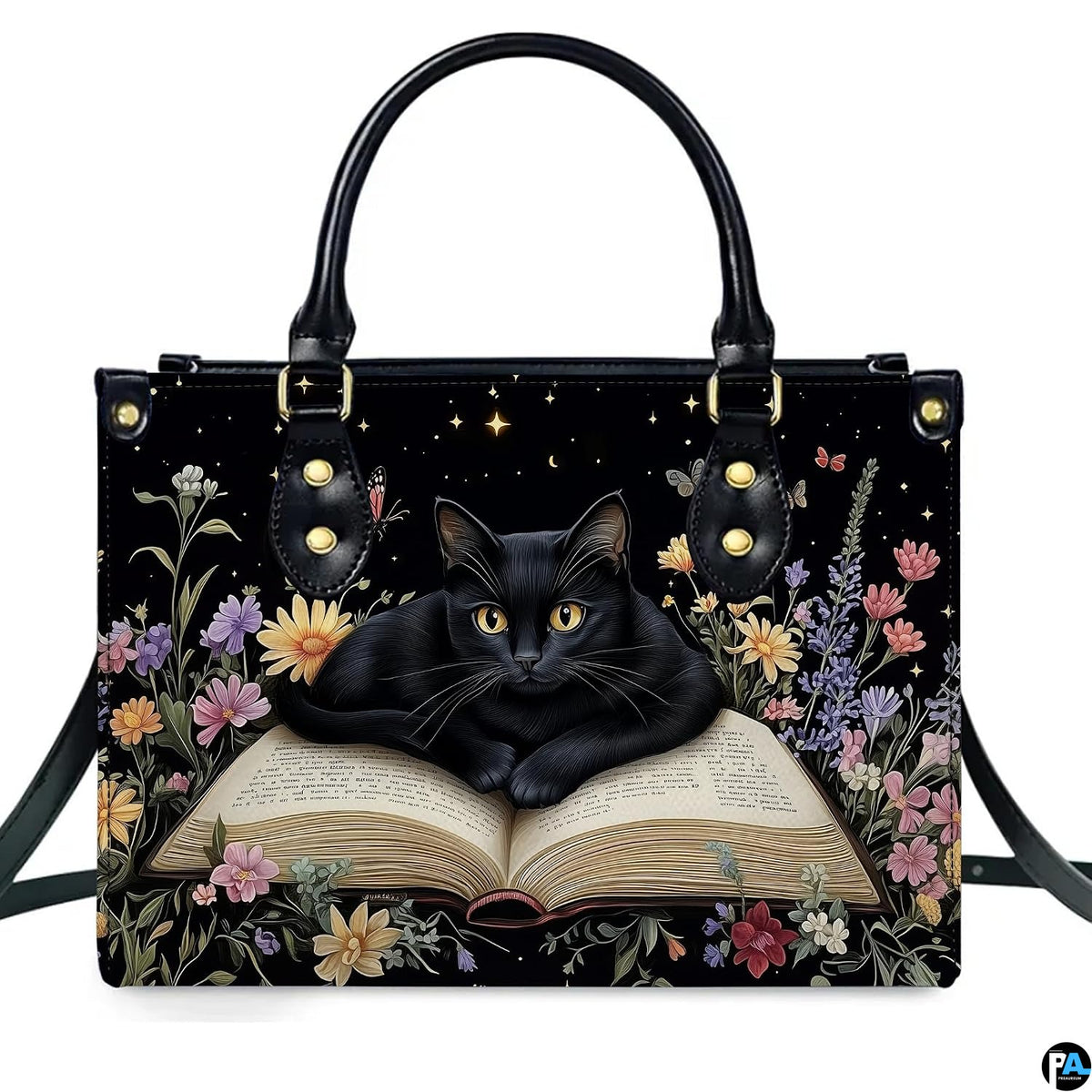 Front studio shot of bookish black cat resting on open book among wildflowers and night starlight.