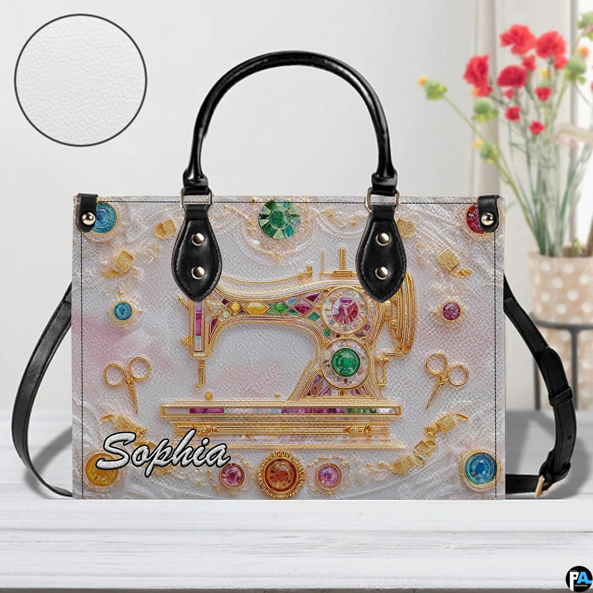 Front studio view highlighting golden sewing machine motif, gemstones, and textured inset disc.
