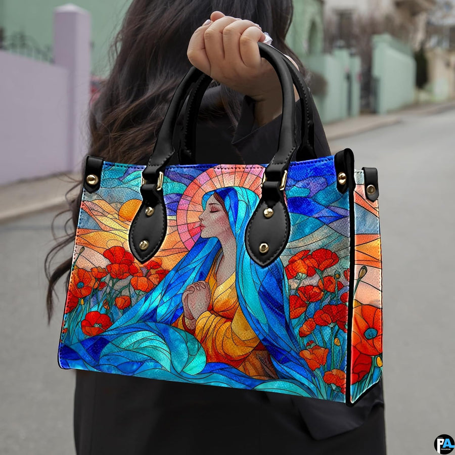 Street lifestyle view of woman wearing stained glass Virgin Mary design with poppy flowers.