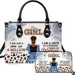 Afro puff art accessory and companion piece depicting illustrated lady, blue watercolor florals, and leopard hearts.