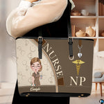Lifestyle model carrying the Mocha Clinician Tote Handbag over shoulder in an indoor room setting.