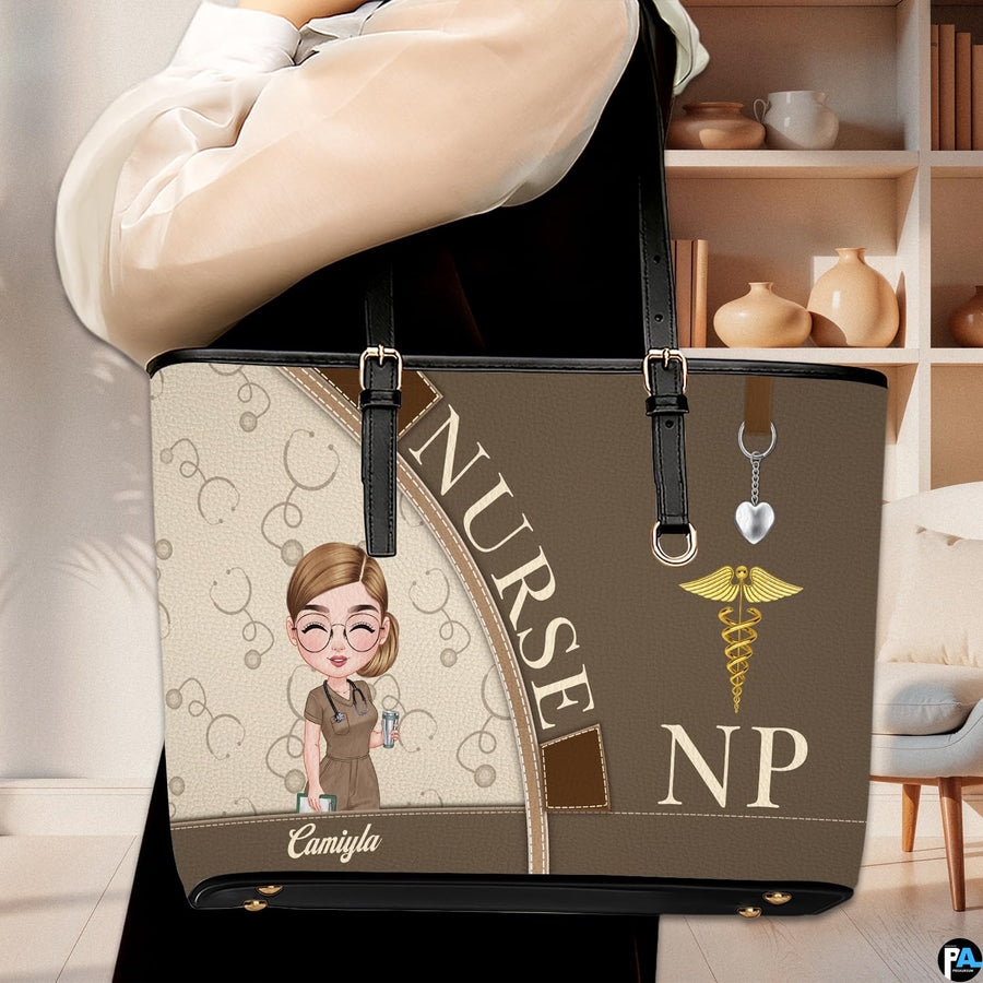 Lifestyle model carrying the Mocha Clinician Tote Handbag over shoulder in an indoor room setting.