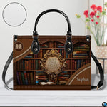 Bookshelf handbag on white wooden table beside floral vase with texture swatch inset.