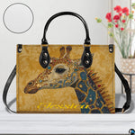Interior compartment view of giraffe handbag showing inner storage organization.