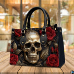 Golden skull handbag and wallet on wooden table beside houseplant and wire trellis.