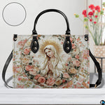 Virgin Mary rose wreath handbag shown on a wooden tabletop with texture swatch