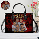 Perspective angle view of crimson handbag highlighting side depth and vibrant lightning print alignment.