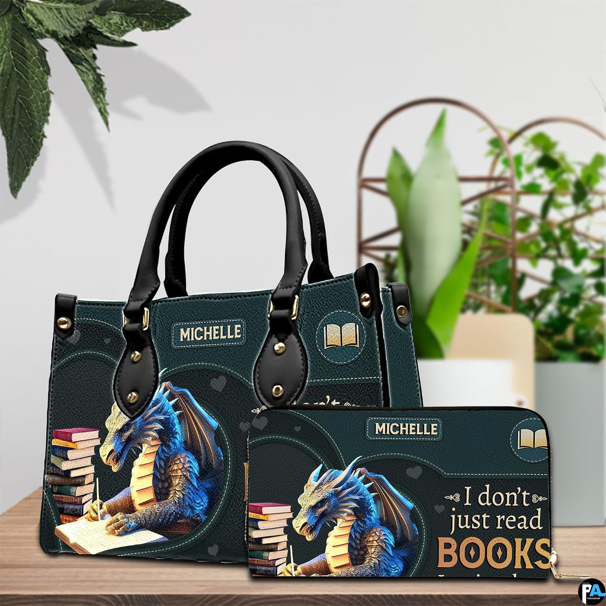 Author blue dragon handbag and matching wallet set displayed on wooden table.