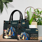 Author blue dragon handbag and matching wallet set displayed on wooden table.