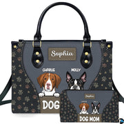 Front view of slate and charcoal dog handbag and matching wallet featuring hound and bulldog illustrations.