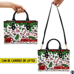 Front view showing dual top handles, attachable shoulder strap, and confectionery holiday drip illustration.