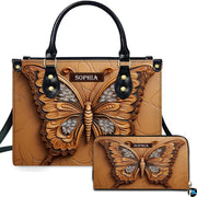 Carved tan butterfly handbag and matching wallet set displayed against a plain white studio background.