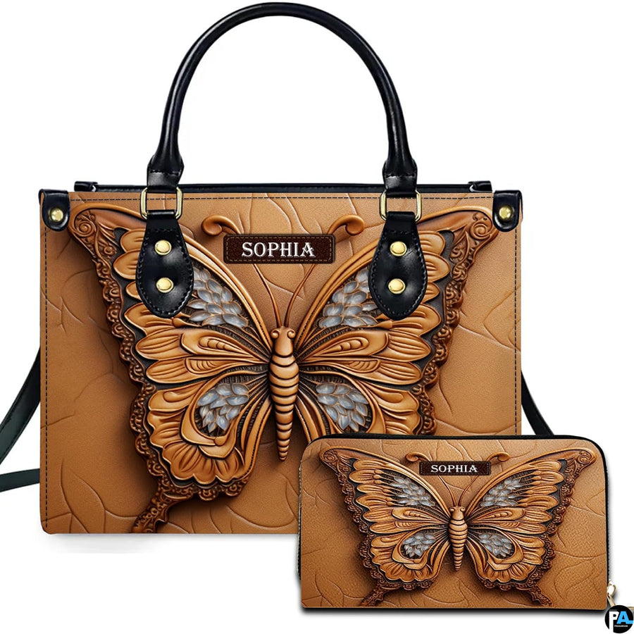Carved tan butterfly handbag and matching wallet set displayed against a plain white studio background.