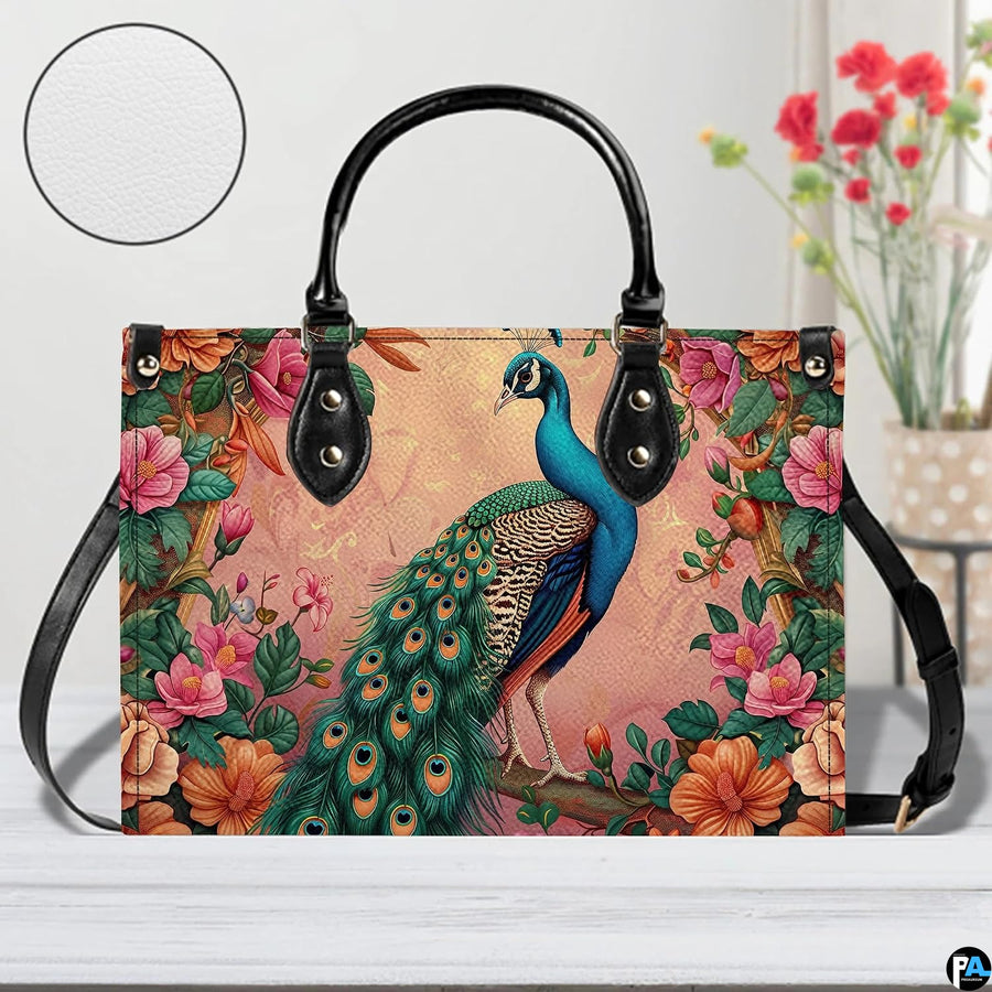 Peacock floral handbag with blush background and long black strap