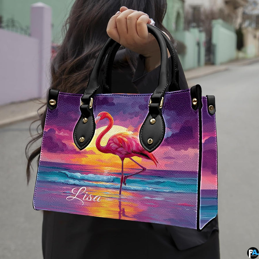 Outdoor lifestyle view of model carrying the sunset beach flamingo handbag.