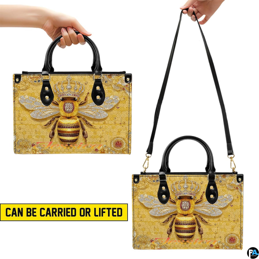 Top-down view of bee handbag showing dual handles and interior storage opening.
