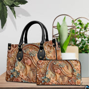 Matching handbag and zippered wallet set displayed together with sculpted Mary art.