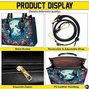 Studio front shot of handbag against white background highlighting twin hummingbirds and full moon.