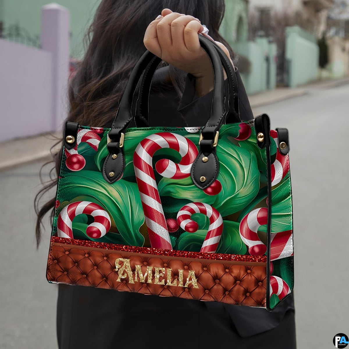 Lifestyle model outdoors carrying the festive candy cane accessory against a street backdrop.