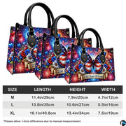 Side perspective view showing patriotic handbag and wallet pair
