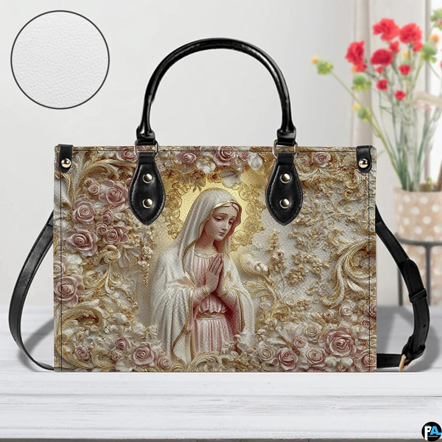 Angled view of sculpted alabaster mary handbag and wallet set showing coordinating devotional relief artwork.