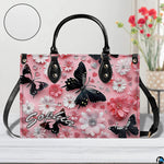 Front close-up view of matching pink daisy butterfly wallet
