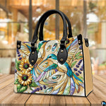 Side profile view of sunflower botanical handbag showing structured silhouette and clean depth.