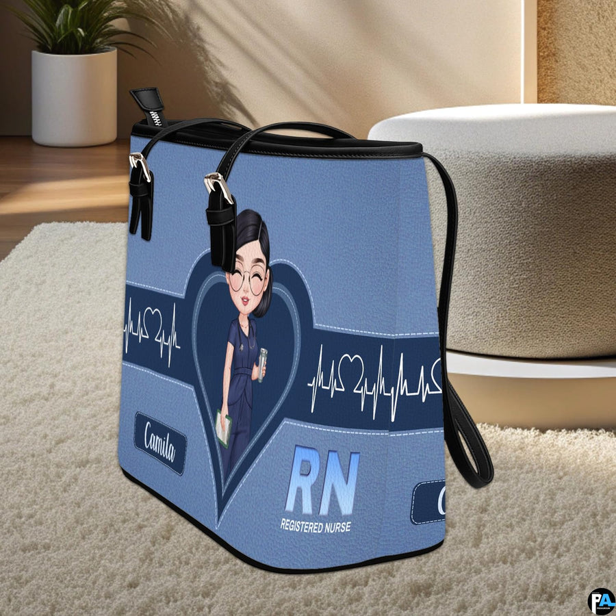 Perspective upright display of Denim Blue Clinician Tote Handbag on a light carpeted floor.