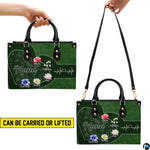 Top-down view of green handbag showing dual handles and interior storage opening.