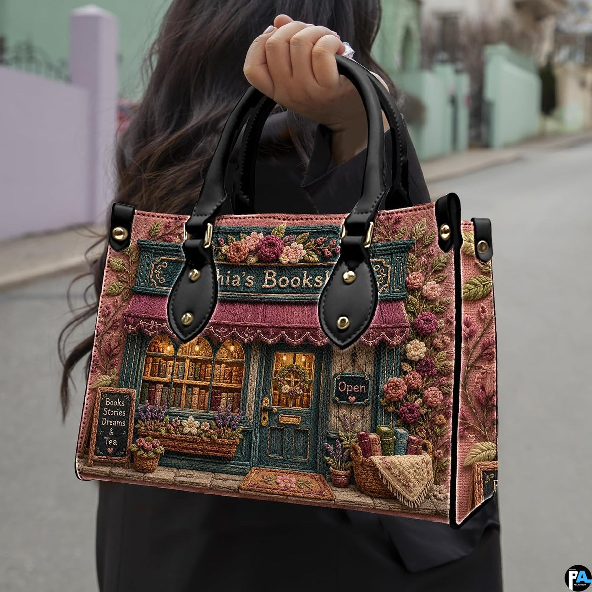 Top-down view of the handbag showing upper opening and dual carrying handles.